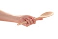 Female hand with a wooden spoon Royalty Free Stock Photo