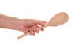 Female hand with a wooden spoon Royalty Free Stock Photo