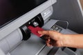 Female Hand Inserting Credit Card in ATM Machine To Transfer Money or Withdraw Cash. Close Up. ATM Transaction Royalty Free Stock Photo