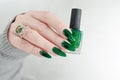 Female hand with long nails and green manicure Royalty Free Stock Photo