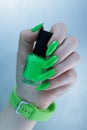 Female hand with long nails and neon green manicure Royalty Free Stock Photo