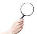 Female hand with magnifying glass. Royalty Free Stock Photo