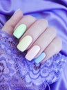Female hand manicure colored lace serenity beauty silk fabric