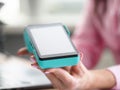 Female hand with manicure holds bank mobile device