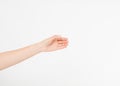 Female hand measuring invisible items, woman`s palm making gesture while showing small amount of something on white isolated back Royalty Free Stock Photo