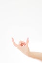 Female hand measuring invisible items, woman`s palm making gesture while showing small amount of something on white isolated Royalty Free Stock Photo