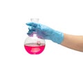 Female hand in a blue rubber glove holds a flask of red medicine on white background isolate Royalty Free Stock Photo