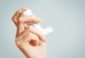 Female hand with a medical asthma inhaler, close-up. Royalty Free Stock Photo