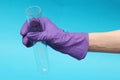 Holding empty test tube with glove Royalty Free Stock Photo