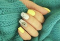 female hand nail beautiful manicure, sweater