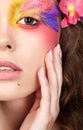 Female with hand near face and fashion feather eyelashes make-up Royalty Free Stock Photo