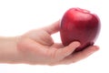 Female hand offeing a red Macintosh apple Royalty Free Stock Photo