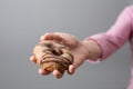 A female hand offering a donut