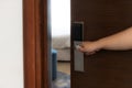 Female hand opening hotel room. Concept about lifestyle, travel, people and tourism