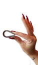 Female hand perfect red fingernails holding big stainless steel clamp Royalty Free Stock Photo