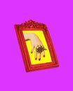 Female hand in picture frame with luxurious gold ring on finger. Contemporary art collage. Creative poster for jewelry