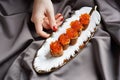 Female hand with a plate of pancakes with red caviar Royalty Free Stock Photo