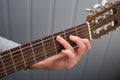 Female hand on fretboard guitar Royalty Free Stock Photo