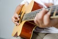 Female hand playing music by acoustic guitar Royalty Free Stock Photo