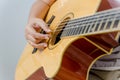 Female hand playing music by acoustic guitar Royalty Free Stock Photo