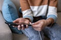 Female hand plugging phone charger, wire, charger Royalty Free Stock Photo