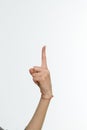 Female hand pointing up with finger number one Royalty Free Stock Photo