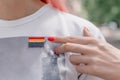 Female hand points to lgbt sign. LGBTQ, lgbt gay pride tolerance concept Royalty Free Stock Photo