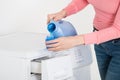 Female Hand Pouring Detergent In The Blue Bottle Cap Royalty Free Stock Photo