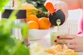 Female hand pours cocktail made of fresh fruit