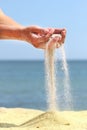 Female hand pours sand Royalty Free Stock Photo