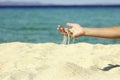 Female hand pours sand Royalty Free Stock Photo