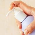 Female hand presses the liquid soap dispenser Royalty Free Stock Photo