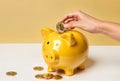 Female hand putting bitcoin into piggy bank on white background, closeup