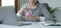 Female hand putting coin into piggy bank. Saving money for future, business investment finance accounting Royalty Free Stock Photo