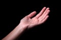Female hand reaching with palms up. Royalty Free Stock Photo