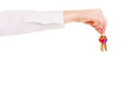 Female hand real estate agent holding set of keys to new house Royalty Free Stock Photo