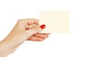 Female hand with red nails holding a blank card Royalty Free Stock Photo