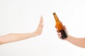 Female hand reject a bottle of beer isolated on white background.anti alcohol concept. Copy space Royalty Free Stock Photo