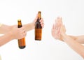 Female hand reject a bottle of beer isolated on white background.anti alcohol concept. Copy space Royalty Free Stock Photo