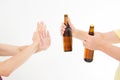 Female hand reject a bottle of beer isolated on white background.anti alcohol concept. Copy space Royalty Free Stock Photo