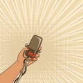 Female hand with retro microphone Royalty Free Stock Photo