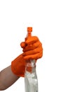 Female hand in a rubber glove holds a spray bottle for cleaning Royalty Free Stock Photo