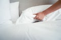 Female Hand set up white bed sheet in room hotel Royalty Free Stock Photo