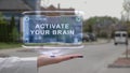 Female hand showing hologram Activate your brain