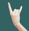 Female hand showing rock n roll gesture.  with clipping path. Woman Hand formed in a goat sign Royalty Free Stock Photo
