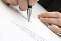 Female hand signing a contract Royalty Free Stock Photo