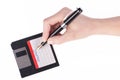 Female hand signs floppy disk Royalty Free Stock Photo