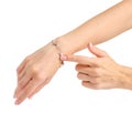 Female hand in silver bracelet pearls