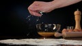 Female Hand Spreading Flour on the Table