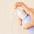 Female hand squeezing liquid soap from container Royalty Free Stock Photo